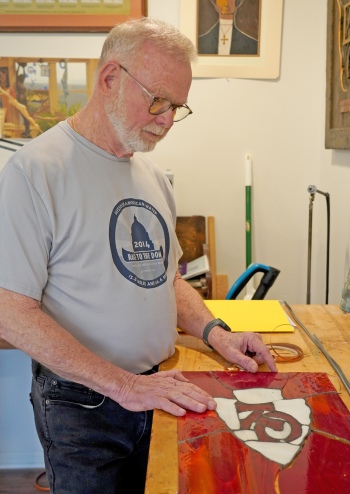 Veteran with artwork on desk