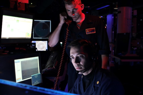Sailors stand watch in the Combat Information Center aboard Arleigh Burke-class guided-missile destroyer USS Benfold (DDG 65) during a trilateral ballistic missile defense exercise with Japan Maritime Self-Defense Force guided-missile destroyer JS Atago (DDG 177) and Republic of Korea Navy Sejong the Great-class destroyer ROKS YulGok Yi I (DDG 992). Benfold is underway in the U.S. 7th Fleet area of operations as part of Destroyer Squadron 15. U.S. 7th Fleet is the U.S. Navy‘s largest forward-deployed numbered fleet, and routinely interacts and operates with allies and partners in preserving a free and open Indo-Pacific region. (U.S. Navy photo by Seaman Alexis Pelletier)