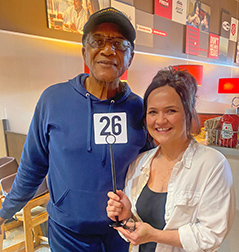 Man and woman with table number 26