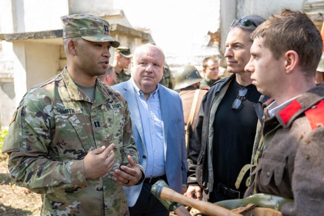 U.S. Army Soldier talks to Bulgarian WWII reenactor