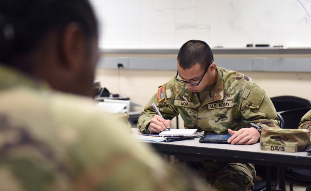 Recruits in the Academic Skills Development Program at Fort Benning, Georgia, study during the self-paced section of the course, March 31. The students work for three weeks to improve their arithmetic reasoning, word knowledge, paragraph comprehension and mathematics.  