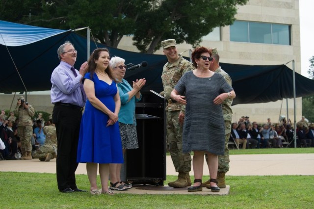 Laura Blevins, Katherine Cavazos, Rebecca Cavazos and Tommy Cavazos watch as the new Bernie Beck gate sign that now reads "Fort Cavazos" is unveiled during the Installation Redesignation Ceremony May 9, 2023. (U.S. Army photo by Kim Hernandez, Fort Cavazos Public Affairs)