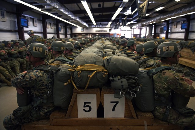 Airborne students wait to board a C-130 cargo aircraft as they prepare to make their second jump during the Basic Airborne Course at Fort Benning, Georgia, March 29. The three-week course teaches service members from every military branch how to safely conduct airborne operations. (U.S. Army photo by Christopher Hurd)