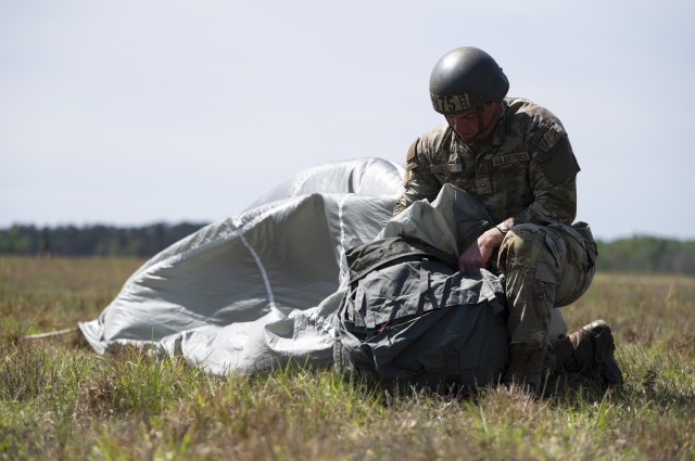 An airborne student packs his parachute after completing a jump during the Basic Airborne Course at Fort Benning, Georgia, March 29. The three-week course teaches service members from every military branch how to safely conduct airborne operations. (U.S. Army photo by Staff Sgt. Dustin Biven)
