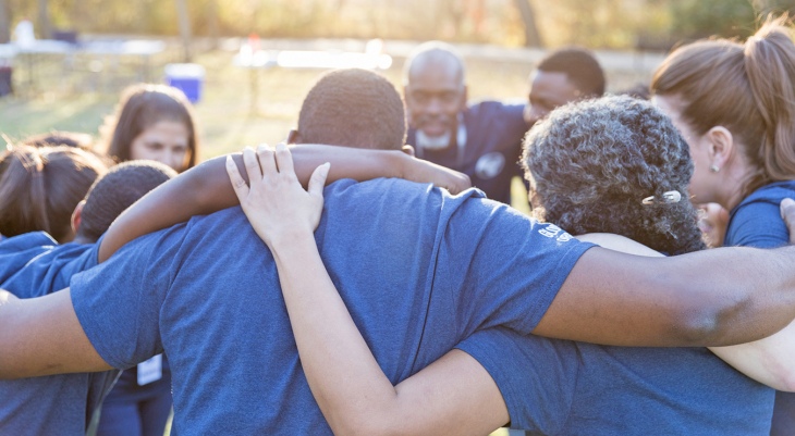 Navy Veteran in group hug