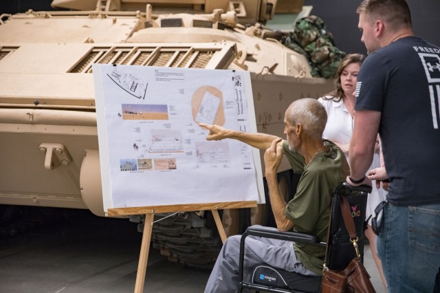 Daniel Reed points to a poster May 30 during a visit to the National Mounted Warrior Museum. He and his family toured through many static displays. (U.S. Army photo by Blair Dupre, Fort Cavazos Public Affairs)