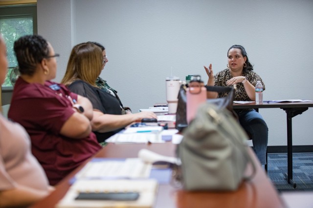 Lina Gonzales asks a question during the seminar. The seminar taught spouses about their benefits and the application process May 23. (U.S. Army photo by Blair Dupre, Fort Cavazos Public Affairs)
