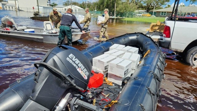 Florida National Guard Soldiers and first responders distribute supplies during Hurricane Ian relief efforts in Arcadia, Fla., Oct. 3, 2022. Florida National Guard's Chemical, Biological, Radiological/Nuclear, and Explosive (CBRNE) - Enhanced Response Force Package (FL-CERFP) assisted first responders as they delivered supplies to areas affected by floods during the historic hurricane impact. Many residents were left without adequate supplies due to the compromised road conditions following the natural disaster. FLNG Soldiers utilized all available assets and personnel to ensure the safety and security of those affected by the adverse conditions. (U.S. Army courtesy photo by Spc. Samuel Herman)