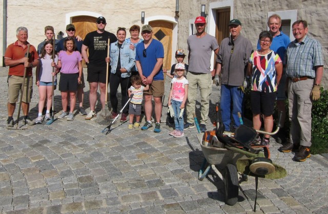 JOINT MULTINATIONAL READINESS CENTER, Germany – Soldiers of the Mustang Team with the Joint Multinational Readiness Center and their Family members worked with their partner city Lupburg, Germany to clean the hill around the town’s castle June 6, 2023. (Courtesy photo)                           