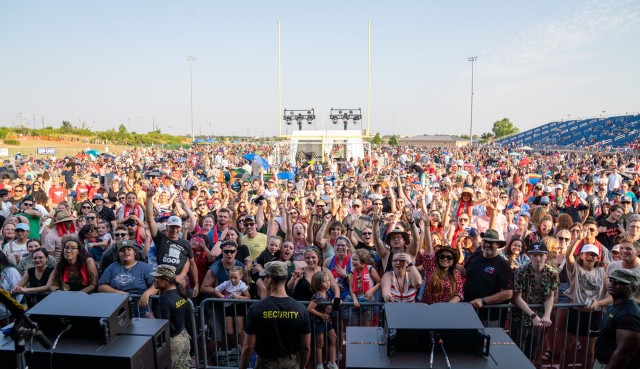 Hundreds of people gather near the stage at Freedom Fest June 23, 2023, at the Phantom Warrior Stadium on Fort Cavazos. (U.S. Army photo by Eric Franklin, Fort Cavazos Public Affairs)