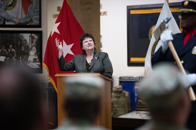 Brenda Lee McCullough, IMCOM – Readiness director, motions to the crowd during the Fort Cavazos Garrison Change of Command Ceremony July 7 at III Armored Corps and Fort Cavazos Headquarters. (U.S. Army photo by Blair Dupre, Fort Cavazos Public Affairs)