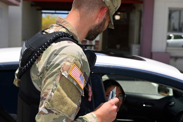 Spc. Rocco DeMatteo, a military police officer assigned to the 247th MP Detachment, demonstrates how to conduct a traffic stop at Torii Station, Okinawa, July 19, 2023. The detachment, which is comprised of 45 Soldiers, recently transitioned from the 10th Support Group to U.S. Army Garrison Okinawa as part of a move to help streamline its mission.