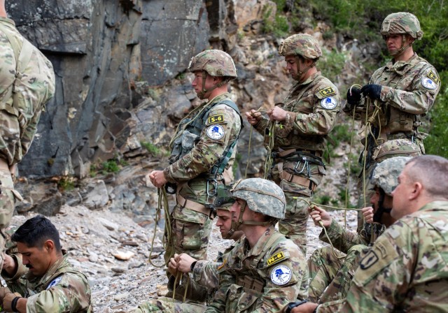 2023 Army National Guard Best Warrior Competition Competitors receive instruction on tying a prussik knot during the competition at Black Rapids Training Area, Alaska on July 10, 2023. The Army National Guard Best Warrior Competition tested the adaptiveness and lethality of our forces. National Guard Citizen-Soldiers remain ready and resilient to meet the nation’s challenges. 