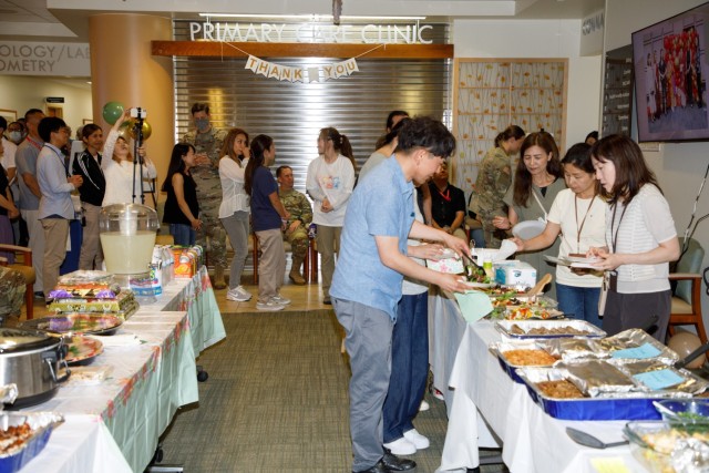 Master labor contractors assigned to U.S. Army Medical Department Activity-Japan enjoy a pot luck lunch during an employee appreciation day at BG Sams U.S. Army Health Clinic on Camp Zama, Japan, July 20, 2023. The event also included an area orientation flight on a UH-60 Black Hawk helicopter over nearby U.S. military health facilities.