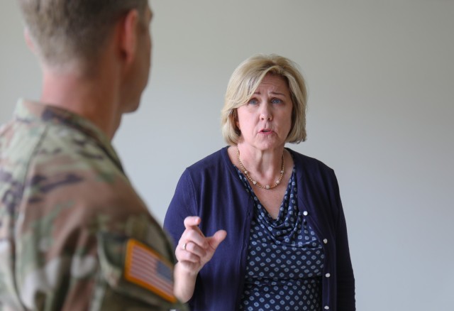 Patricia Coury, deputy assistant secretary of defense for housing, speaks with Col. Marcus Hunter, commander of U.S. Army Garrison Japan, during a tour of housing units at Sagamihara Family Housing Area, Japan, July 20, 2023. Coury had a firsthand look at the housing options USAG Japan provides, including some locations at Camp Zama.