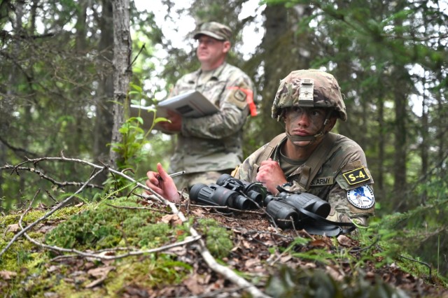 U.S. Army Spc. John Shields, front, a combat medical specialist assigned to the Iowa National Guard, representing Region IV, conducts a spot report as Staff Sgt. Steve Biteler, Recruiting and Retention Battalion, South Dakota National Guard grades Shields performance during the Army National Guard’s (ARNG) Best Warrior Competition (BWC), Joint Base Elmendorf-Richardson, Alaska July 11, 2023. The ARNG BWC tests the adaptiveness and lethality of our forces as our National Guard Citizen-Soldiers remain ready and resilient to meet the nation’s challenges.