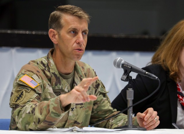 Col. Marcus Hunter, commander of U.S. Army Garrison Japan, answers a question during a workforce town hall at Kizuna Hall on Camp Zama, Japan, Aug. 8, 2023. Hunter, along with Command Sgt. Maj. David A. Rio, garrison senior enlisted leader, and Jenifer L. Peterson, deputy garrison commander, also signed two pledges in support of U.S. Army Installation Management Command’s Service Culture Initiative during the meeting. 