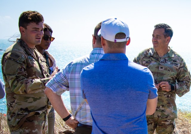 A host of professional staff members representing different congressional districts stand at the observation point as part of the strategic overview brief of Joint Logistics Over-the-Shore during Talisman Sabre 2023 Bowen, Australia, July 29, 2023. The staff delegation was in Australia to observe Joint Logistics Over-the-Shore, one of the many critical sustainment capabilities rehearsed during Talisman Sabre 2023. 