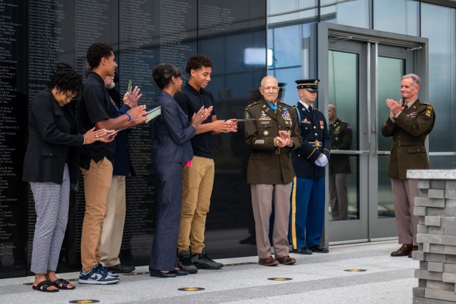 Medal of Honor recipient, retired Col. Paris Davis is joined by his family and Director of the Army Staff, Lt. Gen. Walter E. Piatt, during an engraving unveiling ceremony in his honor at the National Museum of the U.S. Army, Fort Belvoir, Va., Aug. 9, 2023. His name was permanently engraved in granite along the south wall of the Medal of Honor Garden to identify and honor him as one of the recipients of the nation’s highest award for valor. (U.S. Army photo by Bernardo Fuller)