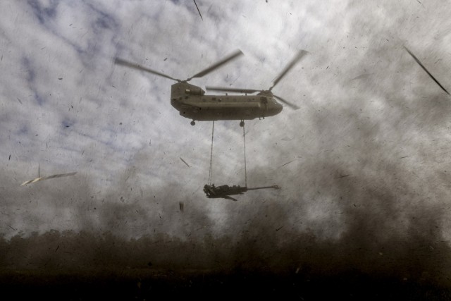 An Army CH-47 Chinook with an underslung M777 Howitzer from 4th Regiment, Royal Australian Artillery, during Exercise Talisman Sabre 2023 at Shoalwater Bay Training Area, Queensland.