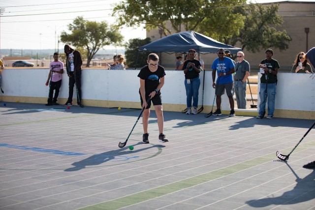Cameron Barnes, 13, participates in a scoring drill during the Boeing-Dallas Stars Hockey Clinic Aug. 10. Barnes was able to have his Dallas Stars hat signed by former National Hockey League players Bob Bassen and Al Montoya. (U.S. Army photo by Blair Dupre, Fort Cavazos Public Affairs)