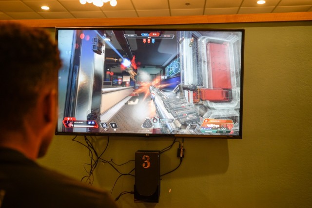 Pvt. 1st Class Nichols Burke plays the video game Apex at the Fort Cavazos USO, competing alongside his team against JBSA. Despite the Fort Cavazos BOSS team not capturing a win, participants expressed appreciation for the experience. (U.S. Army photo by Eric Franklin, Fort Cavazos Public Affairs)