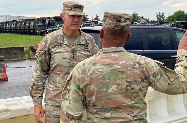 The 21st Theater Sustainment Command’s commanding general, Brig. Gen. Ronald Ragin, greets Vice Chief of Staff of the Army Gen. Randy George upon his arrival to the Coleman Army Prepositioned Stocks-2 worksite in Mannheim, Germany, June 25.