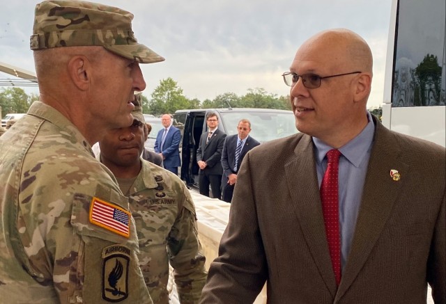 Joseph Scheff, the 405th Army Field Support Brigade deputy to the commander, greets Vice Chief of Staff of the Army Gen. Randy George upon his arrival to the Coleman Army Prepositioned Stocks-2 worksite in Mannheim, Germany, June 25.