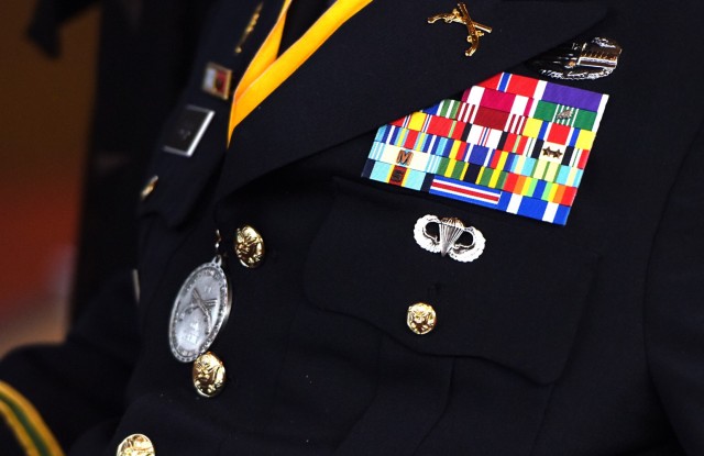 Capt. Luis Avila receives the Military Police Regimental Association's  Order of the Marechausse, silver, during a ceremony at the Memorial Chapel on Joint Base Myer-Henderson Hall, Virginia, Aug. 23. The award is one of the highest honors given to a military police member, and it recognizes a degree of professionalism, high standards of integrity and morality, and esprit de corps. 