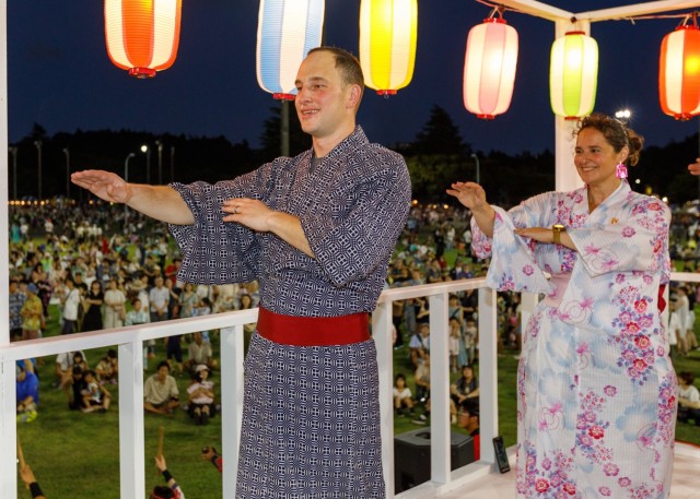 Bon Odori festival attendees perform a traditional dance atop the bon tower at Camp Zama, Japan, Aug. 5, 2023. About 20,000 people attended this year's event, which honors the departed spirits of one’s ancestors. The Japanese festival has been celebrated at Camp Zama since 1959.