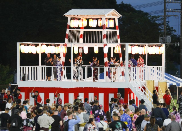 Bon Odori festival attendees dance on and around a bon tower at Camp Zama, Japan, Aug. 5, 2023. About 20,000 people attended this year's event, which honors the departed spirits of one’s ancestors. The traditional Japanese festival has been celebrated at Camp Zama since 1959.