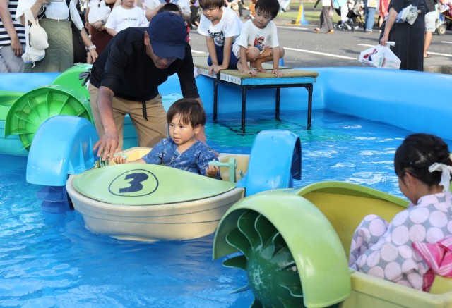 Children enjoy an attraction during the Bon Odori festival at Camp Zama, Japan, Aug. 5, 2023. About 20,000 people attended this year's event, which honors the departed spirits of one’s ancestors. The traditional Japanese festival has been celebrated at Camp Zama since 1959.