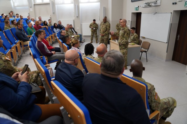 IMCOM Commanding General Lt. Gen. Omar J. Jones, IV talks to the team at U.S. Army Garrison Poland, describing the importance of their mission, during his visit to ID-Europe garrisons Aug. 1, 2023.