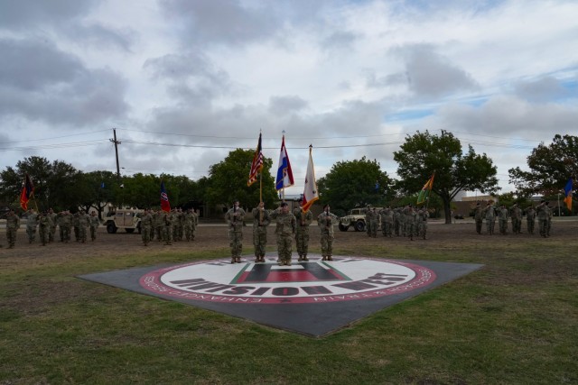 Soldiers of First Army Division West stand in formation behind the division color guard during an Assumption of Responsibility Ceremony held at Fort Cavazos Sept. 21.