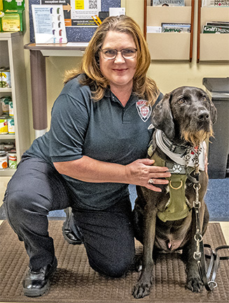 Photos of service dogs her gift to Veterans