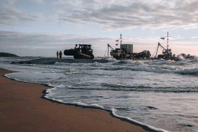 Army mariners discharge vehicles on the beach via the causeway ferry as part of the Joint Logistics Over-the-Shore operation during Talisman Sabre 2023 in Bowen, Australia, July 31, 2023. JLOTS demonstrates the critical capability of bringing vehicles and equipment to the shore in austere environments or when port facilities are unavailable. Talisman Sabre is the largest bilateral military exercise between Australia and the United States, with multinational participation, advancing a free and open Indo-Pacific by strengthening relationships and interoperability among key allies and enhancing our collective capabilities to respond to a wide array of potential security concerns