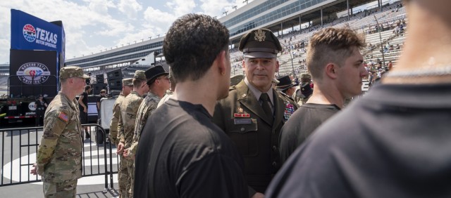 At Texas Motor Speedway during the Autotrader EchoPark Automotive 400 series race Sept. 24, Lt. Gen. Sean C. Bernabe, III Armored Corps and Fort Cavazos commanding general, addresses a vast audience, emphasizing the values of commitment, dedication and patriotism. “By serving in the Army, you will learn how to be a leader,” Bernabe highlighted, underlining the military as a foundation for lifelong success. (U.S. Army photo by Eric Franklin, Fort Cavazos Public Affairs) 