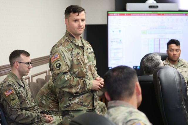Maj. Christopher Lopez, liaison officer to the Japan Ground Self-Defense Force's Northeastern Army, speaks to U.S. Army Japan personnel during a briefing Oct. 18, 2023. Lopez and other liaison officers gathered last week at Camp Zama, Japan, to update staff members on events and operations being conducted by JGSDF armies.