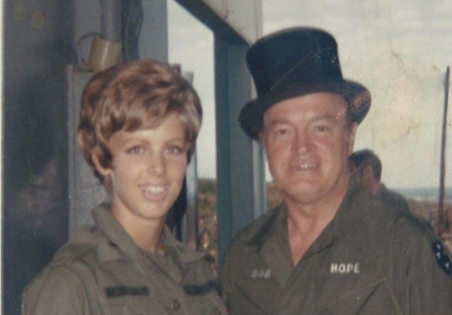 Then-1st Lt. Patti Ehline poses with comedian Bob Hope. Ehline joined the Army to follow in the footsteps of her father who also served during the Vietnam War and in World War II. 
