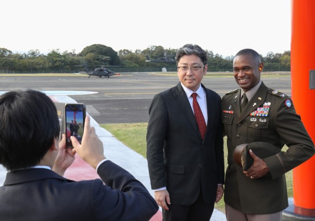 Col. J.P. Smith, right, command chaplain for U.S. Army Japan, poses for a photo in front of Kastner Airfield at Camp Zama, Japan, Nov. 9, 2023. Several Shinto priests and members from the Association of Shinto Shrines visited the installation as part of an ongoing effort to increase interfaith dialogue with unit ministry teams.