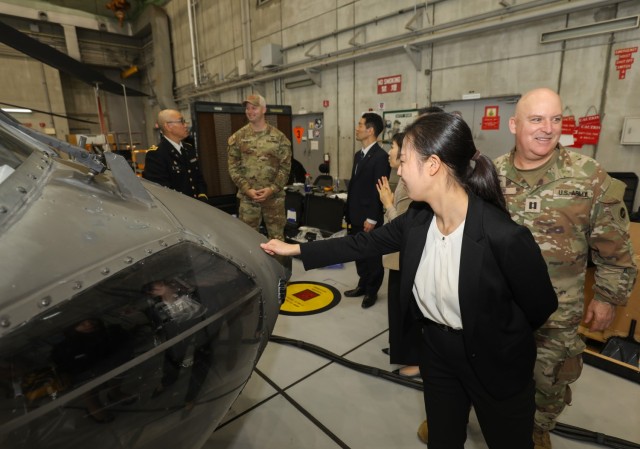 Shinto priests and members from the Association of Shinto Shrines view a UH-60 Black Hawk helicopter during a visit to Camp Zama, Japan, Nov. 9, 2023. The visit was part of an ongoing effort to increase interfaith dialogue with unit ministry teams.