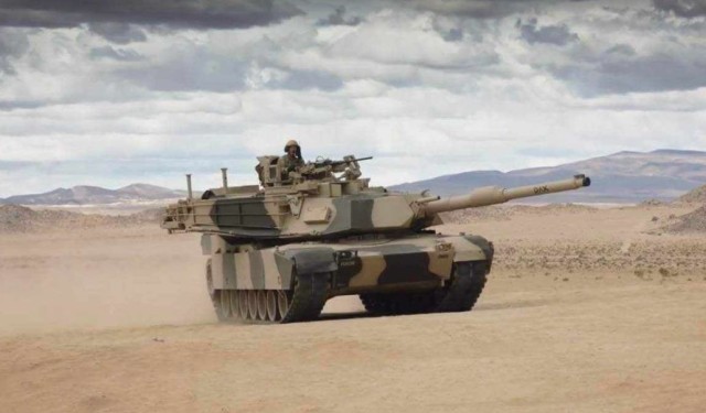 Staff Sgt. Evan Blauvelt, Dealer Company, 11th Cavalry, rides his Abrams tank at the National Training Center, Ft. Irwin, Calif., He is a proud Muscogee/Mohawk warrior.