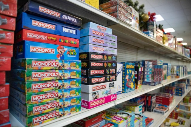 Board games line one of the many toy-filled shelves Nov. 16 at Santa's Workshop at The Great Place during their ribbon cutting ceremony. (U.S. Army photo by Blair Dupre, Fort Cavazos Public Affairs)