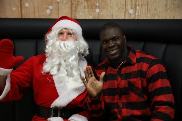 Camp Casey’s Family, Morale, Welfare and Recreation (FMWR) hosted their annual tree lighting event at the Impact Zone, Dec. 1. During the event, service members, civilians, local families and students from local Dongducheon schools gathered for Christmas carols, musical instrument performances and the Christmas tree lighting. Santa made an appearance arriving in a fire truck to give gift bags and take photos with children, and free food and gifts were provided by FMWR, community good neighbors and Army Community Services.  (U.S. Army photos by KATUSA PFC Kim, Yoon Jae)