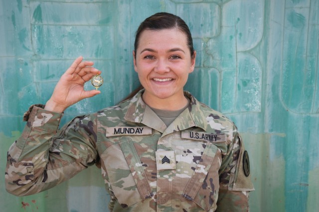 U.S. Army Sgt. Liliana Munday, 218th Maneuver Enhancement Brigade, South Carolina National Guard, holds her French Desert Commando pin Dec. 19, 2023, at Camp Lemonnier, Djibouti. Munday was one of 40 U.S. service members and the only female to go through the most recent iteration of the French Desert Commando Course. (Department of Defense photo by U.S. Air Force Staff Sgt. Dylan Gentile)