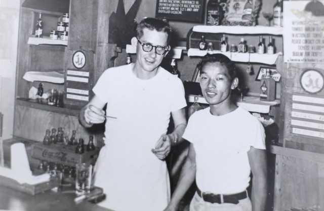 A young Tsuneo Yamagishi, right, can be seen with an American co-worker at the noncommissioned officer's club near the 128th Station Hospital at Sagami-Ono, Japan. Yamagishi, now 95, worked more than 50 years at U.S. Army installations following World War II. 
