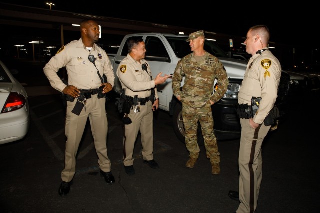 Brig. Gen. D. Rodger Waters, the director of the Joint Staff, Nevada Guard, talks with local law enforcement at University Medical Center in Las Vegas, Nevada, Dec. 31, 2023. Waters spoke with local law enforcement about the Guard's involvement in the New Year's Eve celebrations.