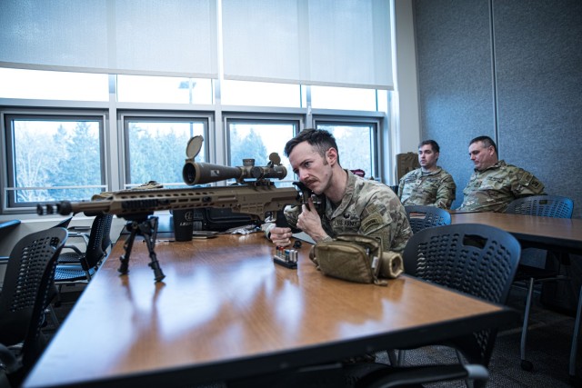 U.S. Army Sgt. Remi Milslagle, a sniper with Headquarters & Headquarters Company, 3rd Battalion, 161st Infantry Regiment, 81st Stryker Brigade Combat Team, Washington National Guard, looks through his rifle scope while attending a class on the MK 22 Precision Sniper Rifle (PSR) at the Pierce County Readiness Center on Camp Murray, Wash., Jan. 16, 2023. The class is part of a training and fielding event to familiarize soldiers with new weapon systems being introduced to the 81st Stryker Brigade Combat Team and 96th Troop Command. 