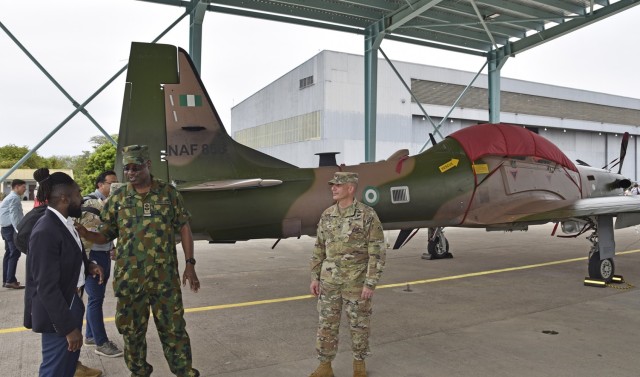 U.S. Army Corps of Engineers, Europe District Project Engineer Wale Adelakun, Nigerian Air Force Air Commodore MA Akiode and U.S. Army Corps of Engineers, North Atlantic Division Commander Col. John Lloyd discuss the positive impacts of construction efforts at Kainji Air Force Base in Nigeria following a ceremony celebrating recently completed base infrastructure improvements there April 27, 2023. 