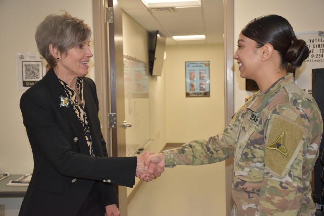 Patty George, wife of Gen. Randy A. George, chief of staff of the Army, greets Sgt. Maritza Pena-Hernandez, Headquarters and Headquarters Battalion, III Armored Corps, Feb. 20 during her visit to the Installation Reception Center at Fort Cavazos.